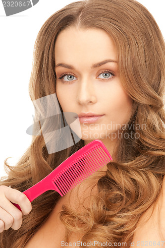 Image of beautiful woman with comb
