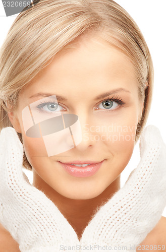 Image of beautiful woman in white mittens 