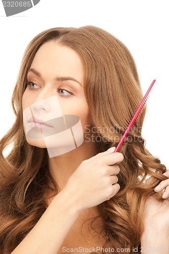 Image of beautiful woman with comb
