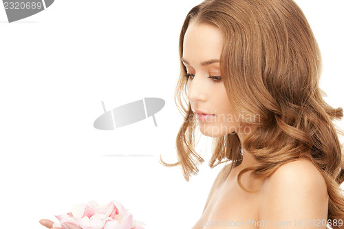 Image of beautiful woman with rose petals