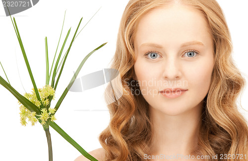 Image of woman with green sprout