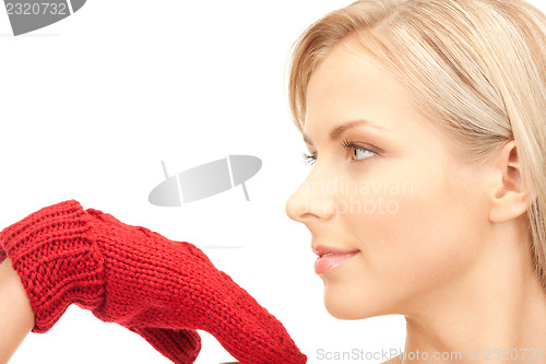 Image of beautiful woman in red mittens
