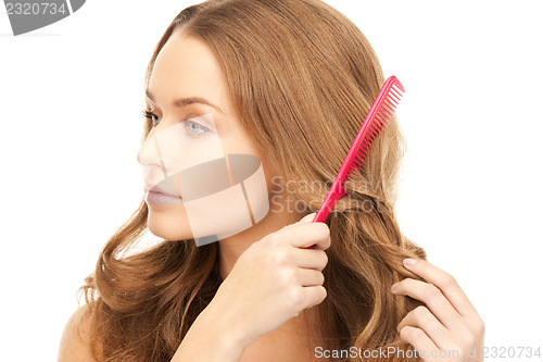 Image of beautiful woman with comb