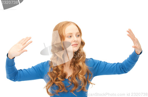 Image of businesswoman working with something imaginary