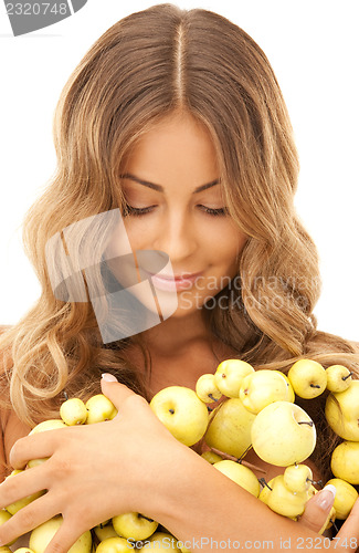 Image of lovely woman with green apples