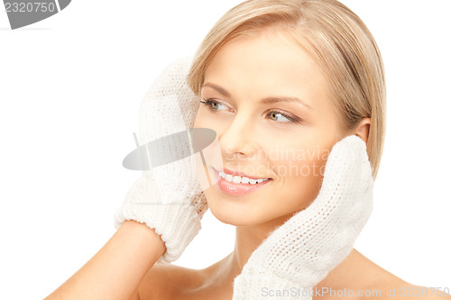 Image of beautiful woman in white mittens