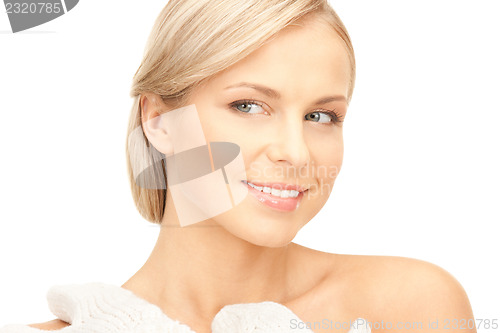 Image of beautiful woman in white mittens