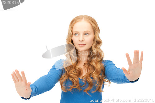 Image of businesswoman working with something imaginary