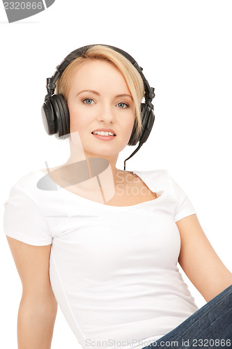 Image of  happy teenage girl in big headphones