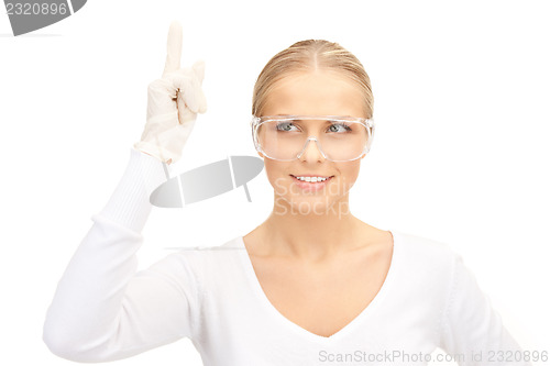 Image of woman in protective glasses and gloves