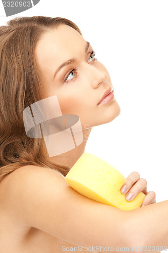 Image of beautiful woman with sponge