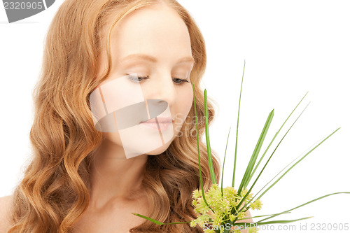 Image of woman with green sprout