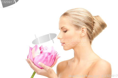 Image of beautiful woman with lotus flower