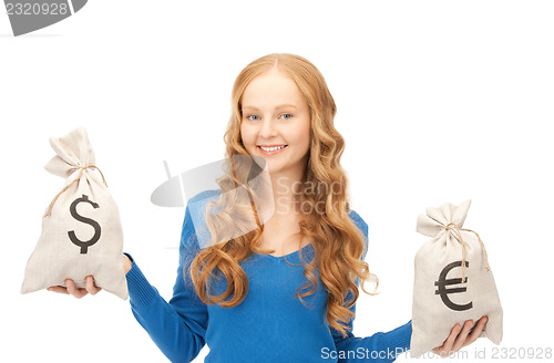 Image of woman with euro and dollar bags