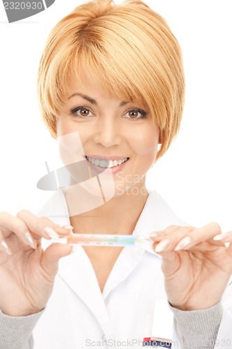 Image of attractive female doctor with thermometer