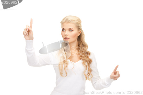 Image of businesswoman working with something imaginary