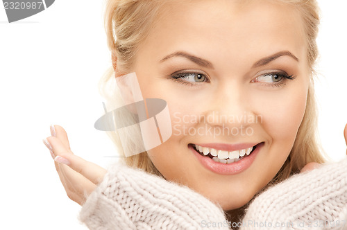 Image of beautiful woman in mittens  