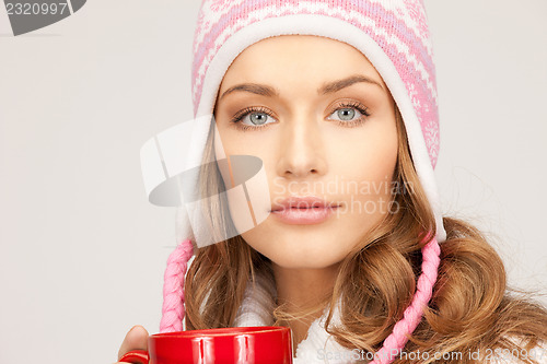 Image of beautiful woman with red mug