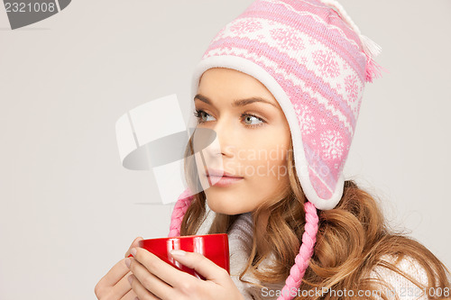 Image of beautiful woman with red mug