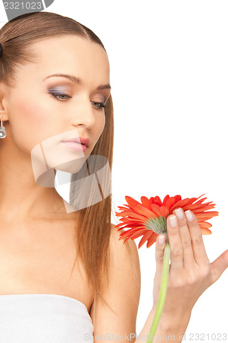Image of lovely woman with red flower