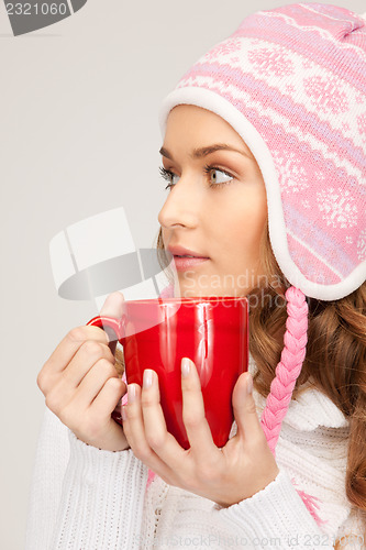 Image of beautiful woman with red mug