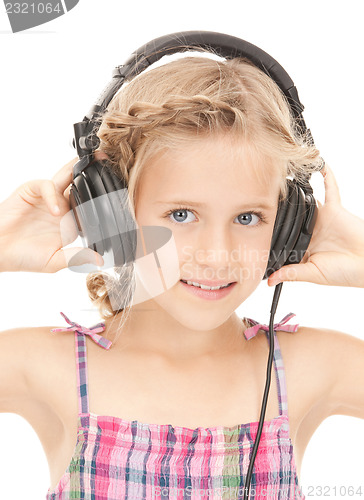 Image of happy girl in big headphones