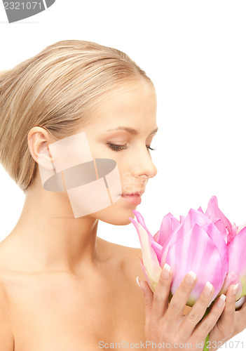 Image of beautiful woman with lotus flower