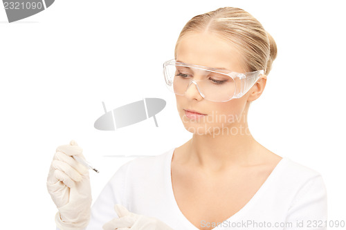 Image of attractive female doctor with thermometer