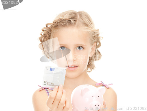 Image of little girl with piggy bank and money