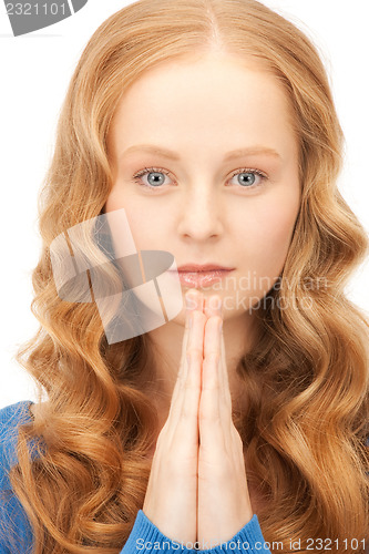 Image of praying businesswoman