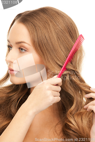 Image of beautiful woman with comb