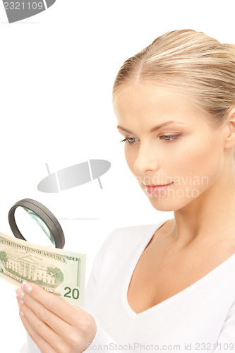 Image of woman with magnifying glass and money