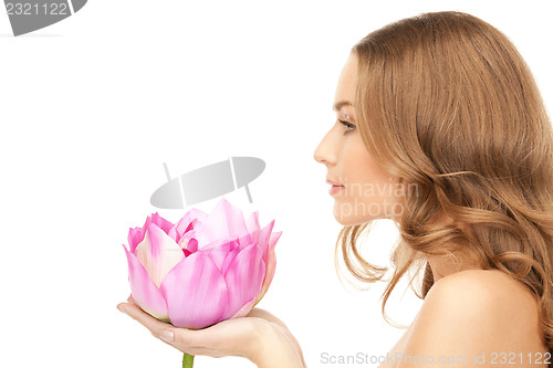 Image of beautiful woman with lotus flower