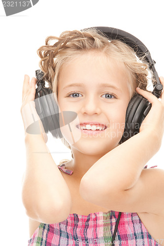 Image of happy girl in big headphones