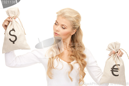 Image of woman with euro and dollar bags