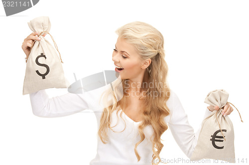 Image of woman with euro and dollar bags