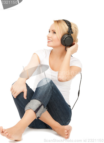 Image of  happy teenage girl in big headphones