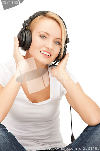 Image of  happy teenage girl in big headphones