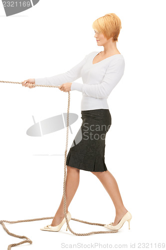 Image of business woman pulling rope