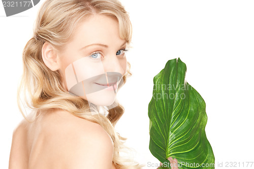 Image of woman with green leaf