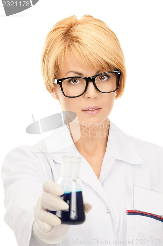 Image of lab worker holding up test tube