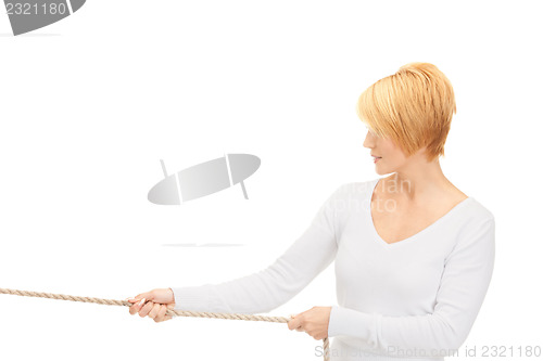 Image of business woman pulling rope