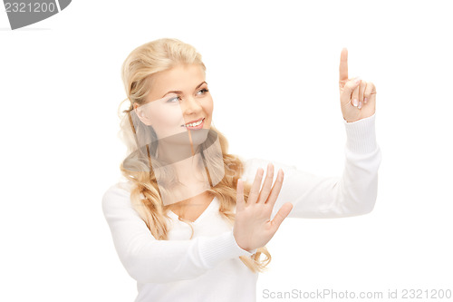 Image of businesswoman working with something imaginary