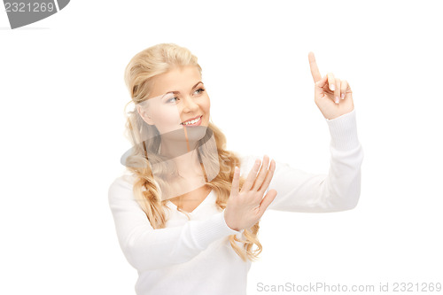 Image of businesswoman working with something imaginary