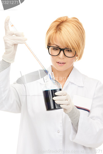 Image of lab worker holding up test tube