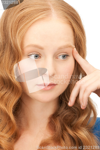 Image of pensive businesswoman over white