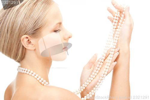 Image of beautiful woman with pearl beads