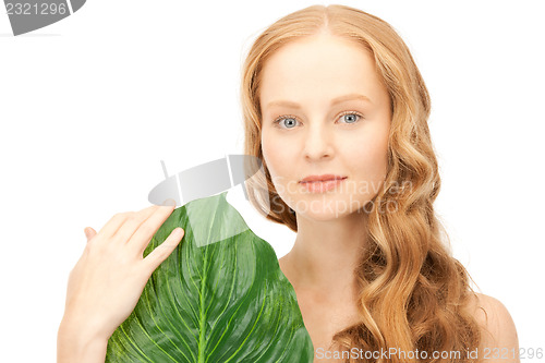 Image of woman with green leaf