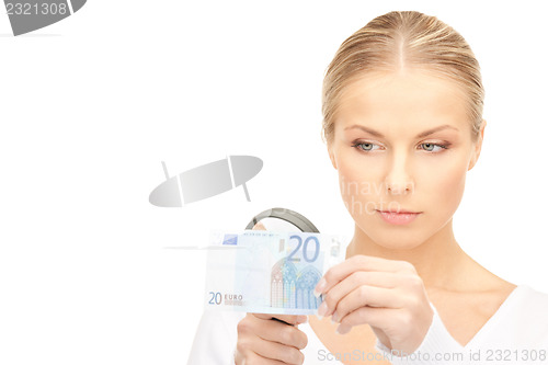 Image of woman with magnifying glass and money