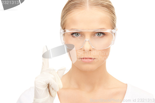 Image of woman in protective glasses and gloves
